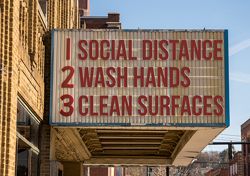 theater marquee with hand washing instructions.